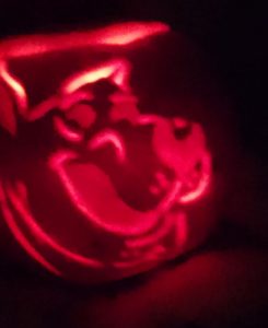A Pumpkin with Scooby-Doo carved into it.